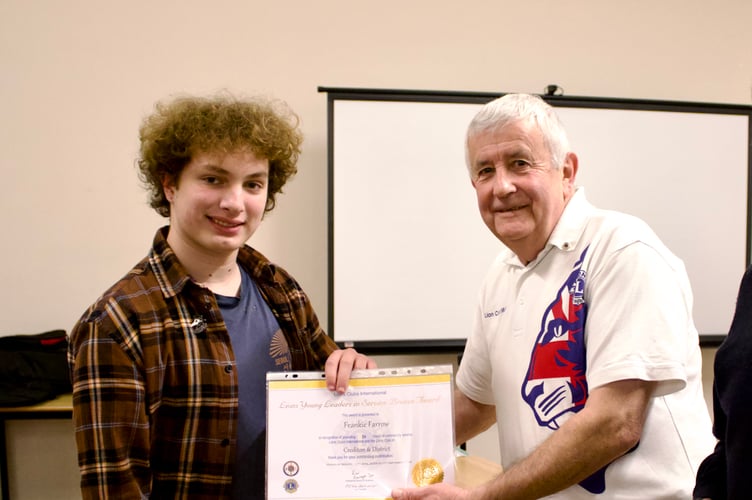 Frankie Farrow receiving his Lions Young Leaders in Service Bronze Award from Lion Colin Marsh