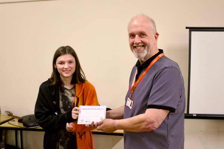 Kacey Osborne receiving her Crediton Youth Service award from Deputy Mayor Steve Huxtable