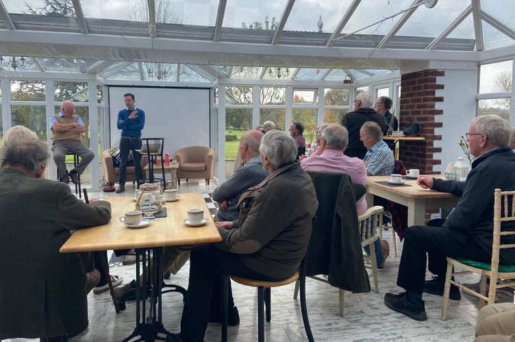 Some of the members of Crediton Vintage Farmers Group listening to Crediton Dairy's Agricultural Manager, Mr Andrew Butler.
