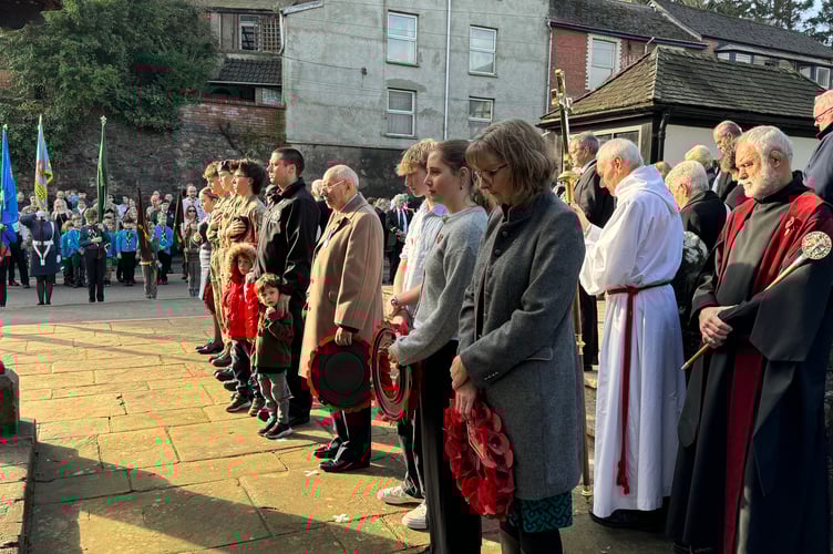Ready to lay wreaths, from left, Cadets, Crediton Fire Brigade, Lions and QE School representatives.  AQ 7315
