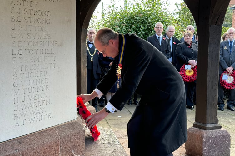 Henry Parker, chairman, Crediton RBL, laying the branch wreath. AQ 7333