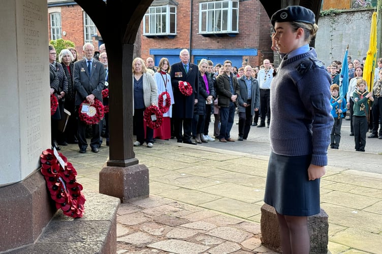A Cadet salutes after laying her wreath.  AQ 7337
