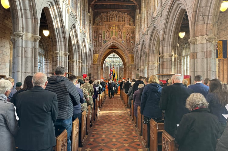 The parade leaving Crediton Parish Church.  AQ 7299
