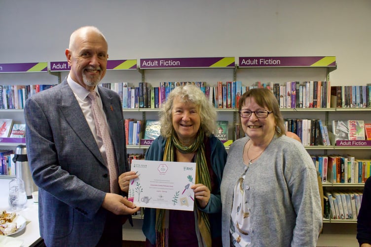 Esther Mann, centre, and Dee Ross receiving the certificate for Sustainable Crediton from Deputy Mayor Steve Huxtable.