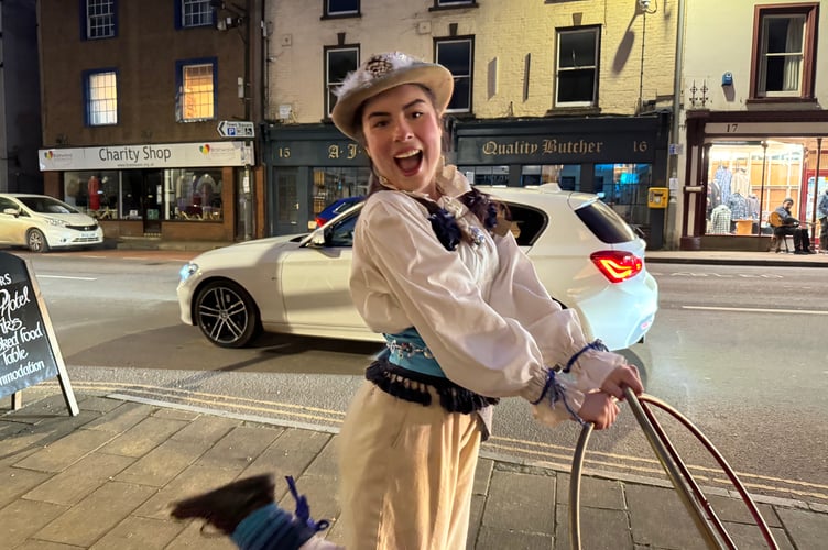 Penny Sugarplum Plonk held interactive hula hoop performances with late night shoppers.  AQ 6682
