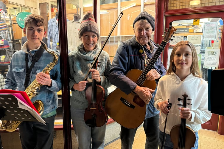 Buskers raising funds for the charity Second Sight at a recent Late Night Shopping evening, from left, Zeph Corthorn, Francisca Van Holthoon, John Richards and Flora Corthorn.  AQ 6689

