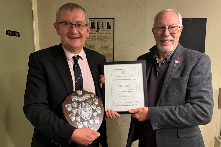 Alan Quick, left, receiving the Rotary Crediton Citizen of the Year Award from Rotary president Fred Oliver. AQ 7549