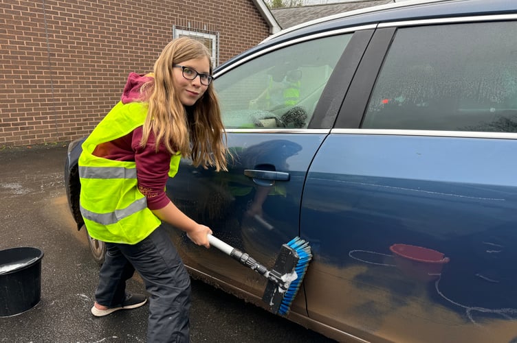 Hard at work on a very muddy car at Copplestone. AQ 7801