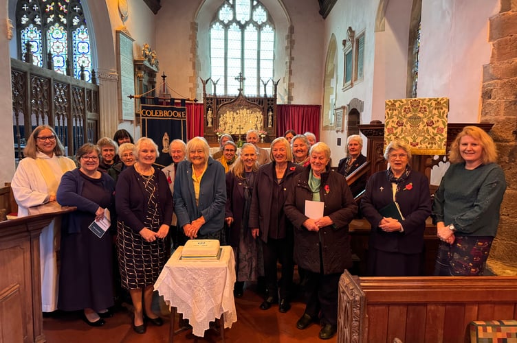 Before the cutting of the celebration cake to celebrate 100 years of Colebrooke branch of the Mothers’ Union.  AQ 7089