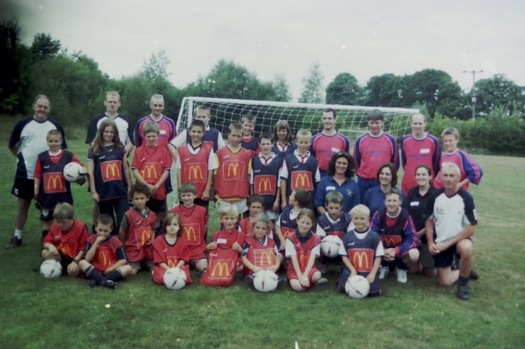 Tedburn St Mary Youth FC players and coaches at a training day, where kit and equipment were given by McDonald's in August 2003. DSC00027