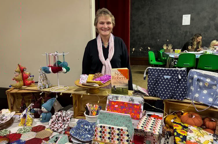 Sue Frost from Crediton sold handmade quilted, knitted and sewn items, making her first appearance at Sandford Craft Fair.  AQ 7889
