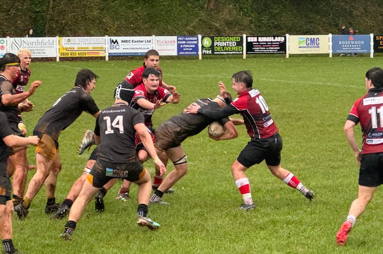 Crediton Colts power ahead with the ball against Exeter Saracens Colts. AQ 8436