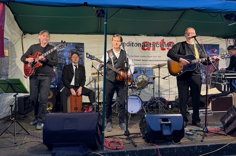 The Beatnxs had people dancing in the Town Square.  AQ 8934