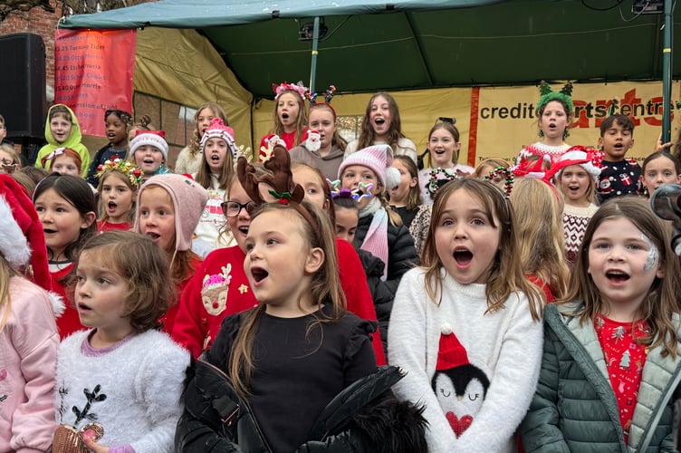 Children enjoyed singing in the town square.  AQ 8852