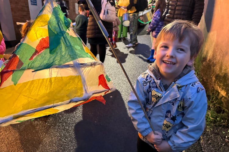 A youngster with his lantern ready for the Procession of Light.  AQ 8955