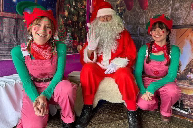 Father Christmas and his elves.  AQ 8791
