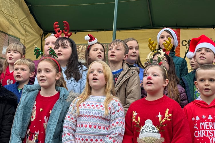 Children enjoyed singing watched by parents and family.  AQ 8872