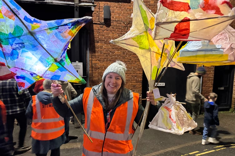 Town Clerk Rachel Avery with some of the lanterns after the Procession of Light.  AQ 9016