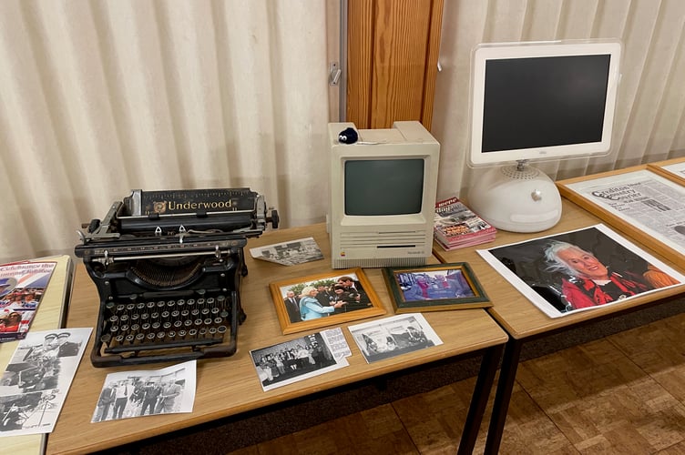 An old typewriter, Apple Macintosh, iMac with photos of Sue Read and royal visits