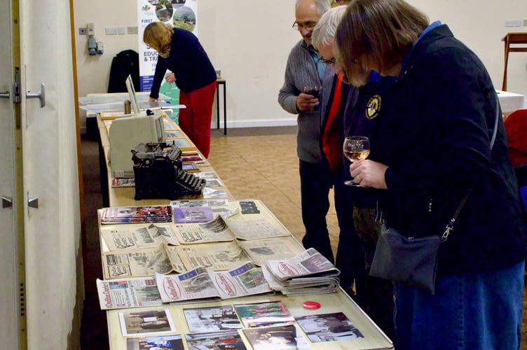 Guests looking at the display of the Courier's history