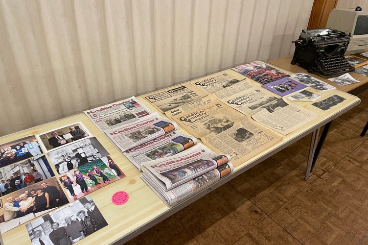 Old copies of the Crediton Courier with photos of former staff