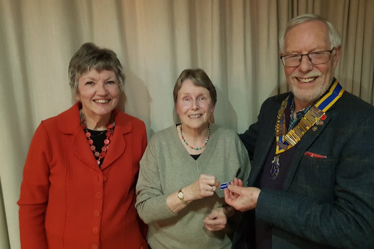 Julie Maddison being presented with her members badge by Crediton Rotary President Fred Oliver with membership secretary Sheila Ralph, left.