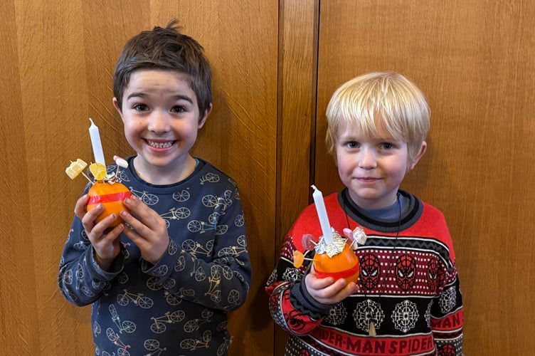 Christingles made ahead of the service in Crediton Parish Church.  AQ 0102

