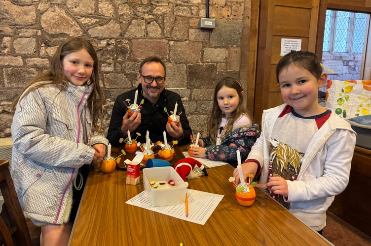 Keeping busy making Christingles in the Lady Chapel in Crediton Parish Church.  AQ 0106
