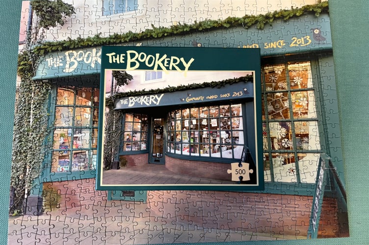 A uniquely designed 500-piece puzzle has been created in partnership with All Jigsaw Puzzles based in Hatherleigh depicting the Bookery window at Christmas.
