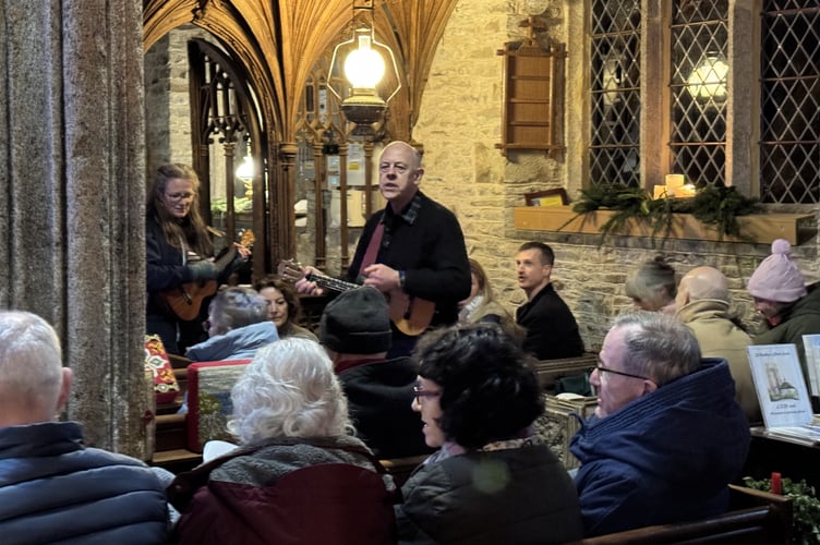 Josh and the Festive Ukeleles played and led the singing for 'Feliz Navidad'