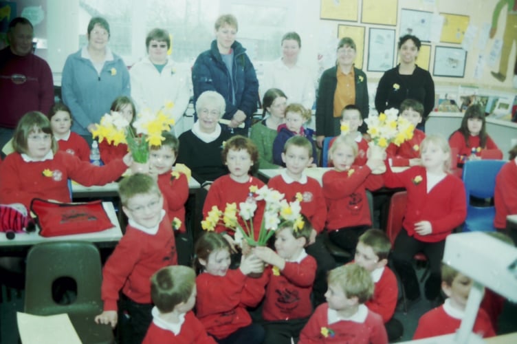 Pupils from Spreyton School presented daffodils to visitors who read Wordsworth's poem 'Daffodils' to raise funds for Marie Curie Cancer Care in March 2004. DSC01347