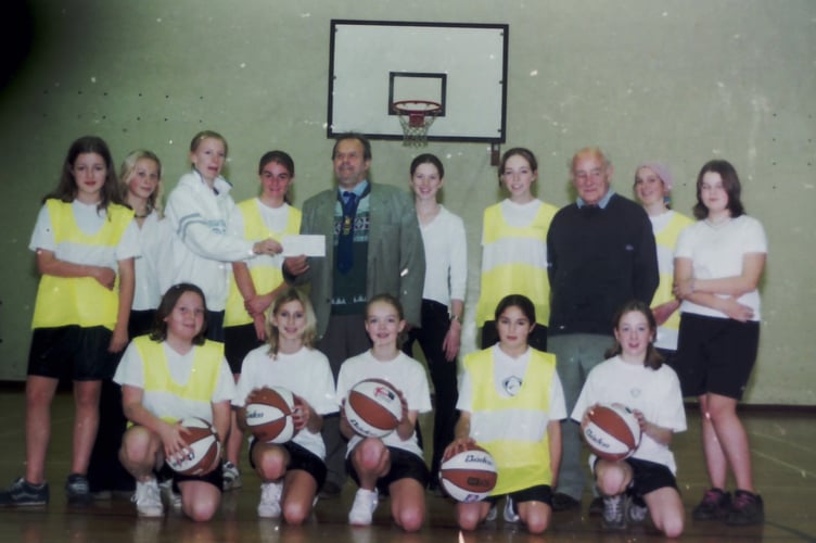 QECC basketball girls' team received a cheque from the White Swan Cheese Club in November 2003. DSC00436