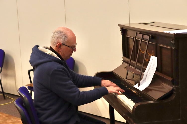 4 January 2024 Rotary Club of Crediton Boniface’s New Year Afternoon Tea Party for senior citizens Piano playing while guests enjoy afternoon tea (Will Goddard, Crediton Courier)
