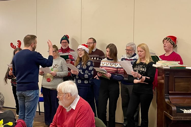 4 January 2024 Rotary Club of Crediton Boniface’s New Year Afternoon Tea Party for senior citizens Volunteer choir singing (Will Goddard, Crediton Courier)