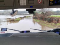 Dramatic boat rescue for couple from vehicle in floodwater