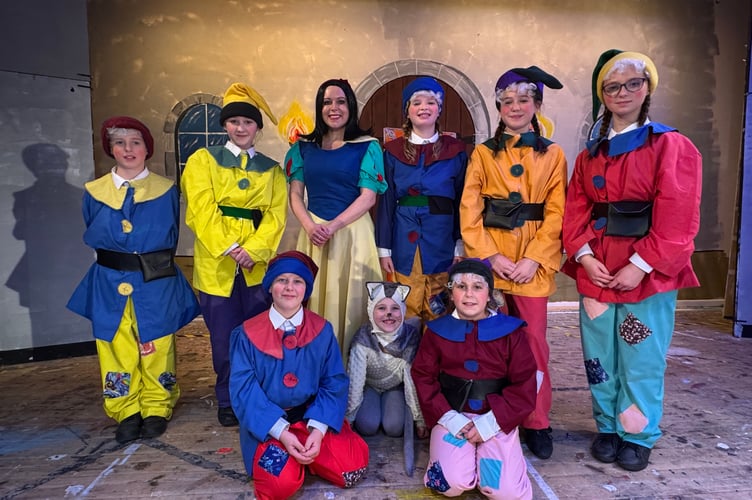 Snow White, the seven dwarfs and Ruby the Cat during rehearsals for Snow White at Tedburn St Mary.  AQ 2102
