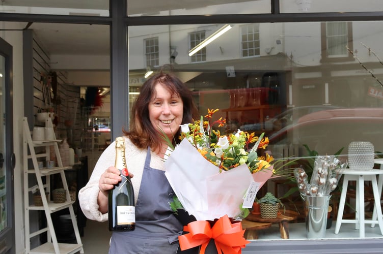 Gwyneth Emanuel outside Bud2Blooms, formerly Divine Flowers on Crediton High Street