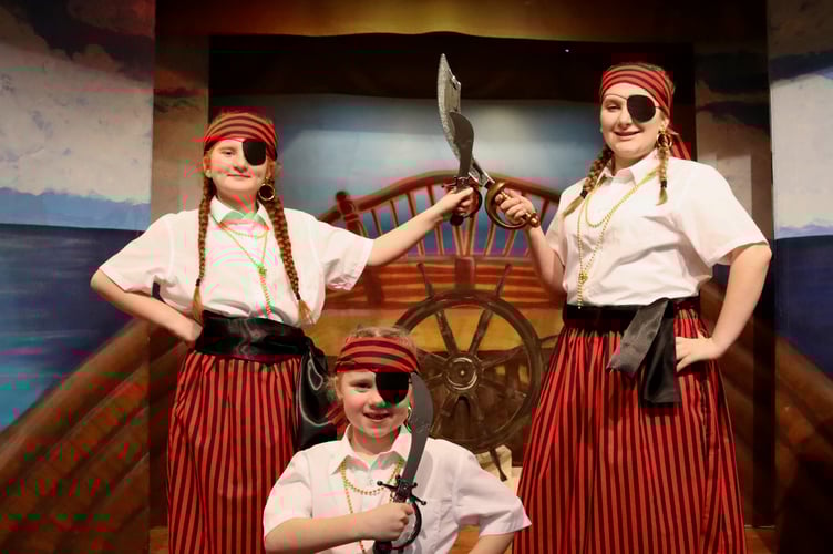 Young pirates with cutlasses and eyepatches
