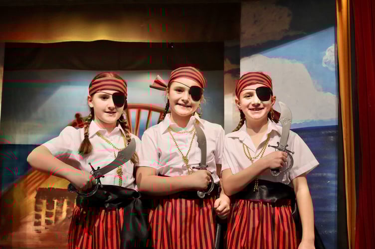 Young pirates with cutlasses and eyepatches