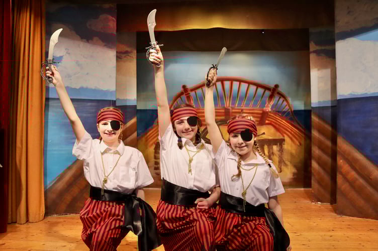 Young pirates with cutlasses and eyepatches