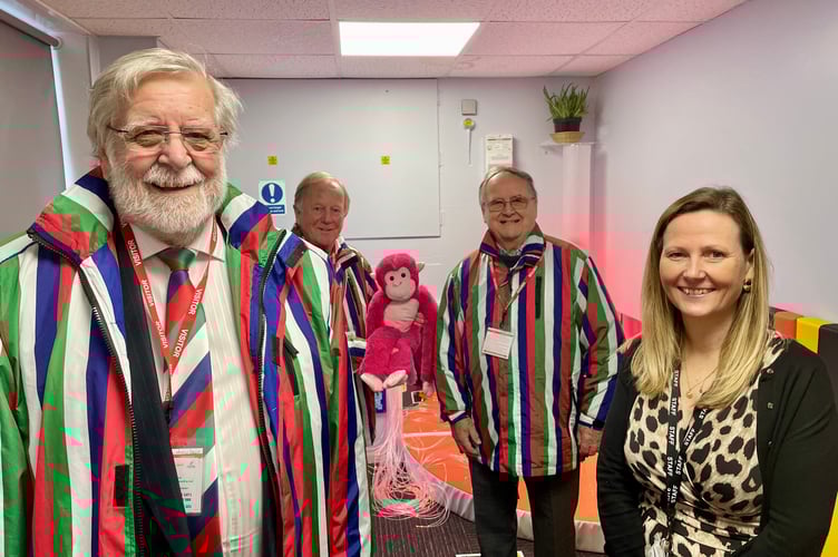 From left, Roger Haywood, Mike Wisdom and Brian Drake of Wooden Spoon, Headteacher Jessica Wright