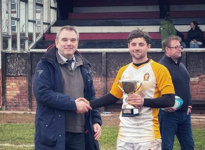 Ollie Avery-Wright receiving the Geoff Warne Memorial Trophy.
