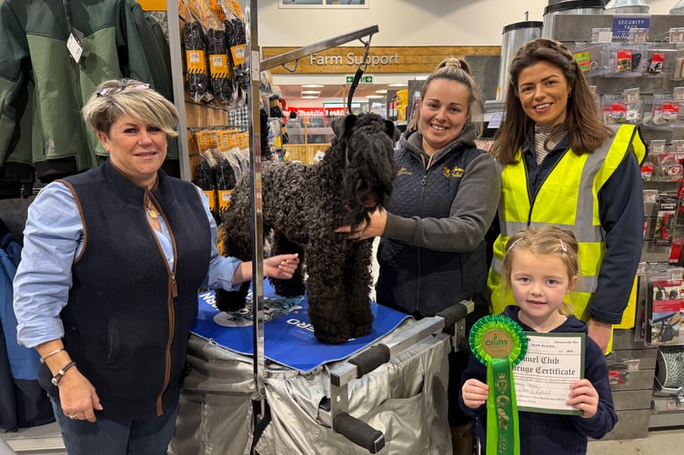 Nancy, a Kerry Blue Terrier, a Crufts Winner, Champion of Devon winner and Manchester Champion, went to the Pet Day, pictured with owner Josephine Pinfold, from Newton St Cyres, left, her daughter-in-law, Chantelle and granddaughter Evie, with Lauren Cook from Mole Avon.  AQ 3088
