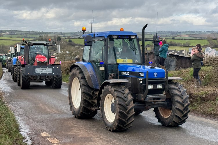 Tractors make their way from Cheriton Fitzpaine on the charity tractor run. AQ 3383