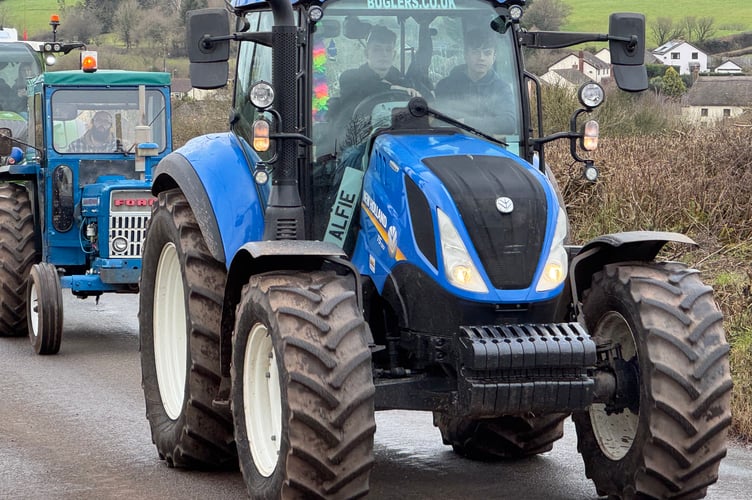 Young farmers lead the way on the charity tractor run. AQ 3386