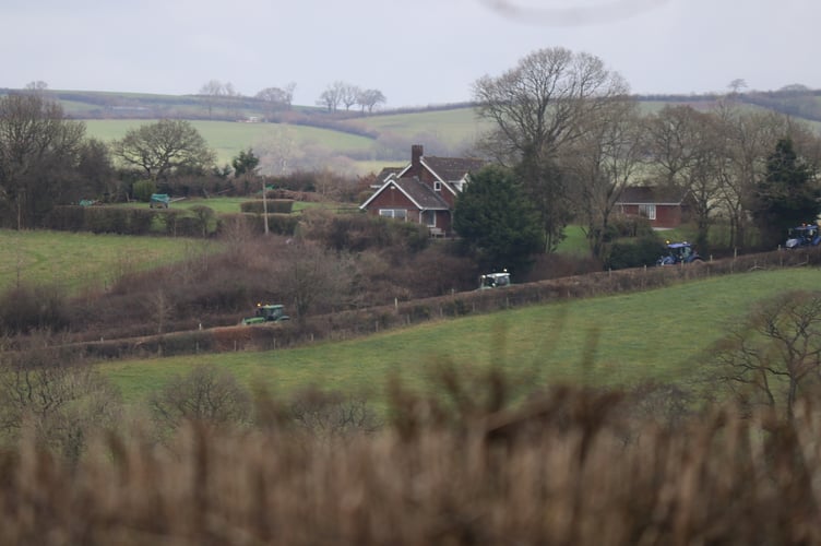 Tractors on the charity tractor run approach Cheriton Fitzpaine.  AQ 5952
