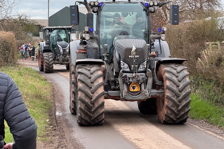 A wave on the charity tractor run as it left Winscott Barton.  AQ 3328
