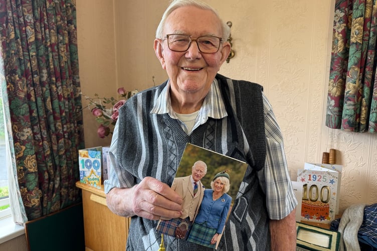 Reg Nott with his card from King Charles and Queen Camilla on his 100th birthday.  AQ 3523