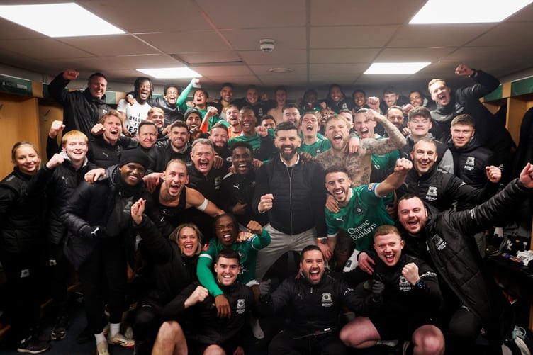 Plymouth Argyle players and staff celebrate their famous victory over Liverpool in the FA Cup