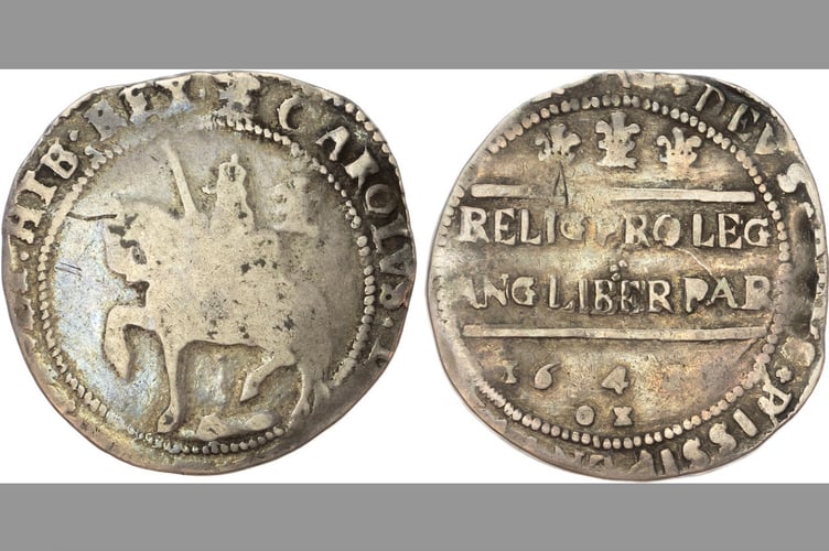 Found in the rafters at Crediton Parish Church, one of the silver coins.